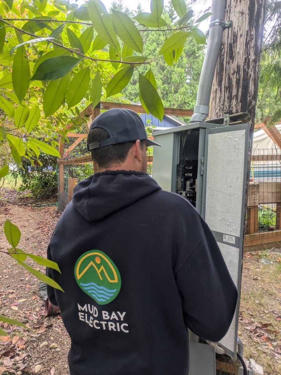 Bill Hayes on the job — Mud Bay Electric hoodie with logo